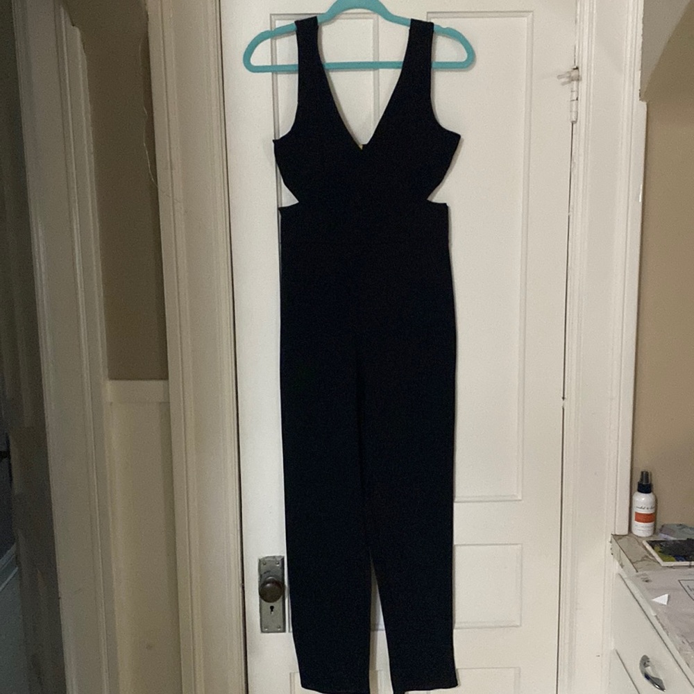 Black cut out side pantsuit .